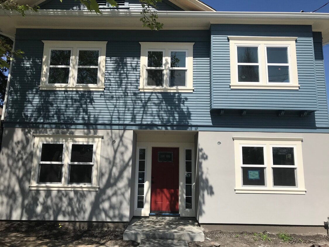 Completely renovated upper unit. This photo was taken before the sconces were installed. Landscaping will be completed prior to May 1. - 314 Rigg St