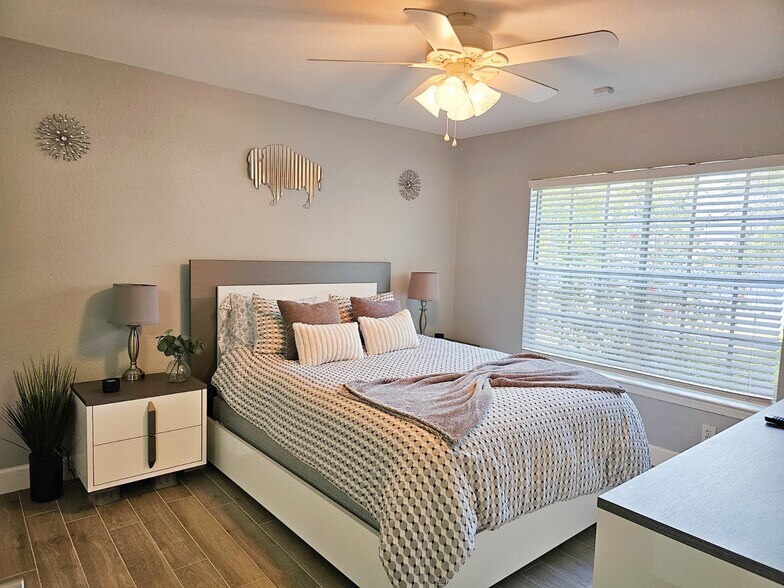 The master bedroom features a queen bed, dresser, smart tv, large walk in closet and ensuite - 8923 Manor Loop
