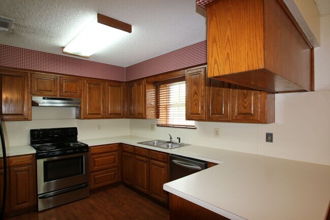Building Photo - Corner Lot Charmer Off Chapel Creek | 4BR/2BA with Fireplace, Garden Tub & Fenced Backyard