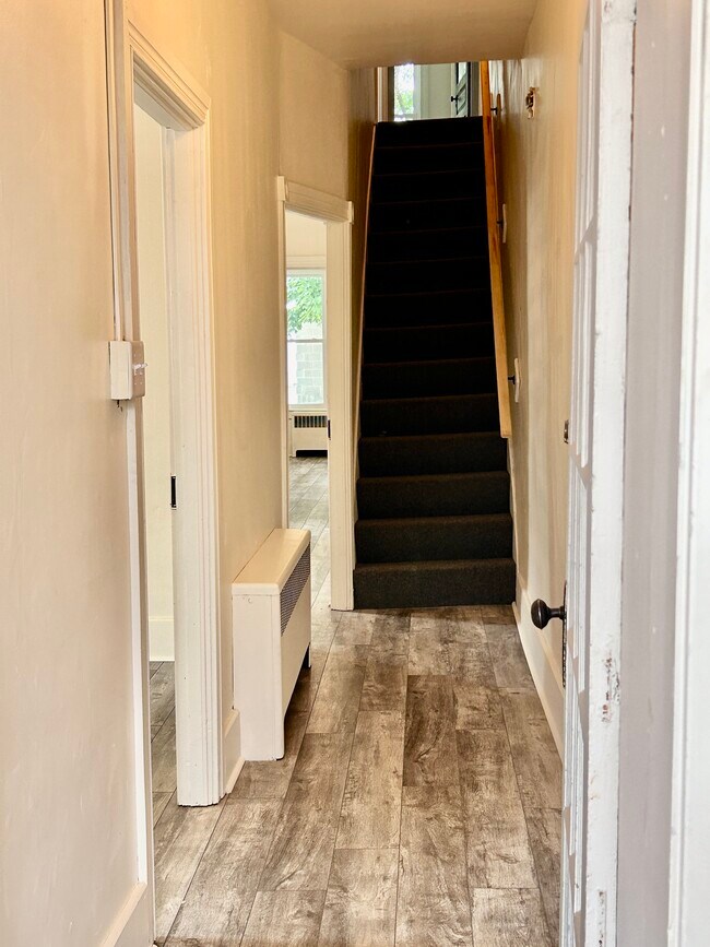 From the front door, hall to the stairs - 15 E Gay St