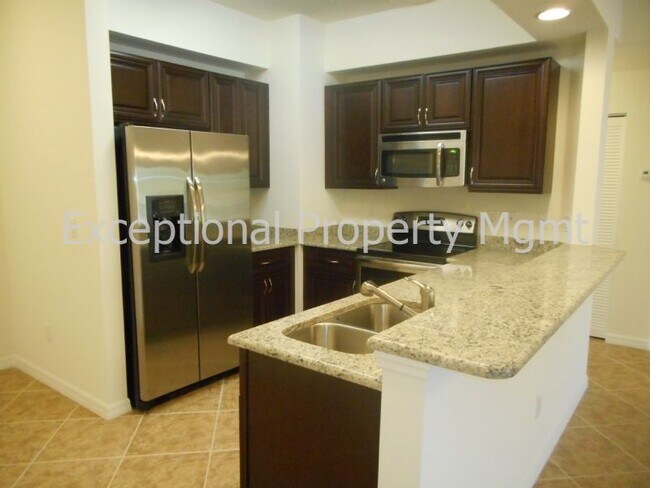 Building Photo - 2 Bedroom + DEN and GARAGE! Water &amp; Basic Cable Included!