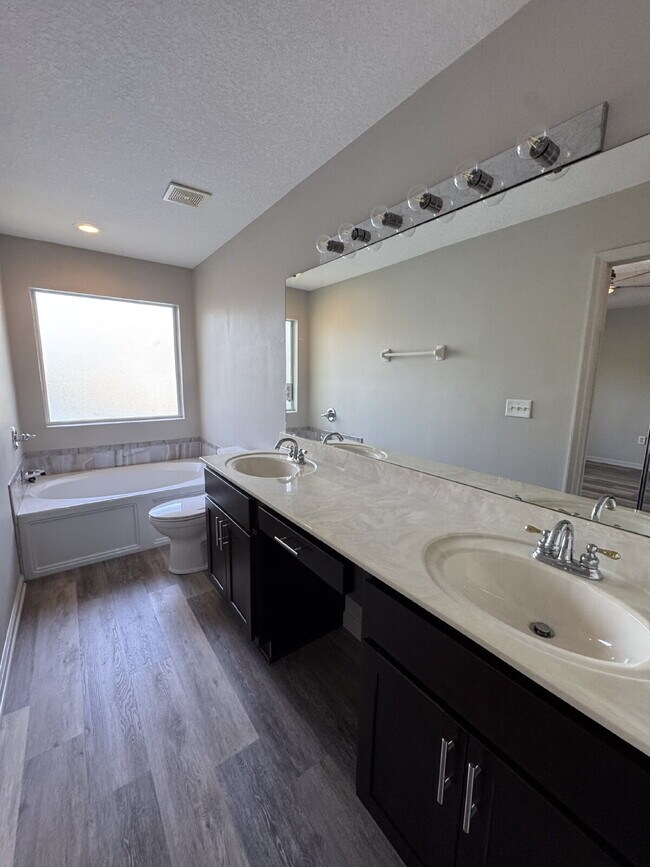 Building Photo - Spacious 4 Bedroom Pond-View Home with Upg...