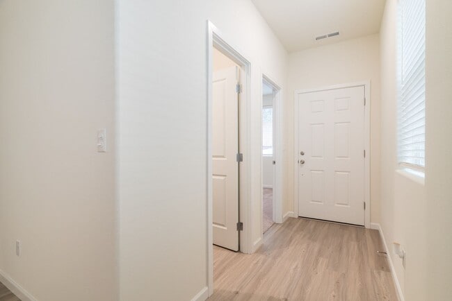 Building Photo - Super clean & spacious 4-bdrm/3-bath townhome in NE—Attached garage, great location