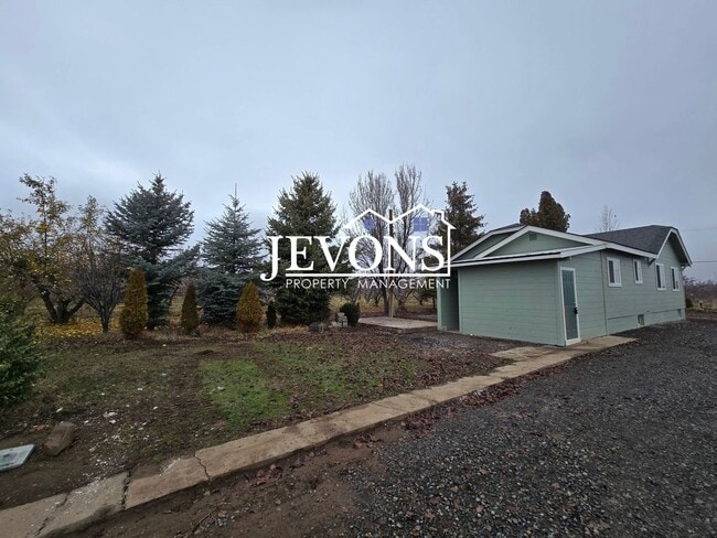 Building Photo - 3 bedroom home with washer and dryer – 1-acre lot next to an orchard – Large and small pets allowed!