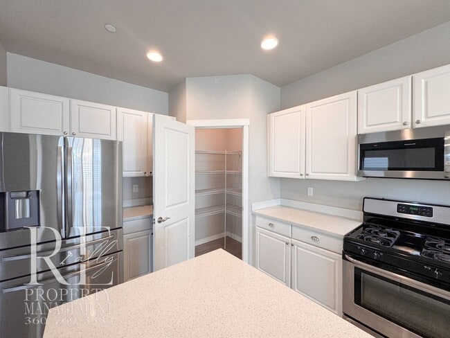 Building Photo - Vaulted Ceilings, Tree-Lined Views & a Spacious Primary Suite Retreat