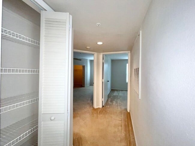 Building Photo - Move in NOW- Spacious 2 bedroom 1 bath condo on 3rd floor in gated community! Water included with...