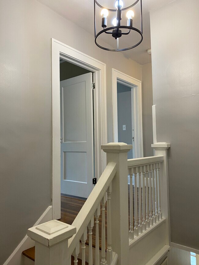 Stairwell with large pendant light - 3901 N Pennsylvania St