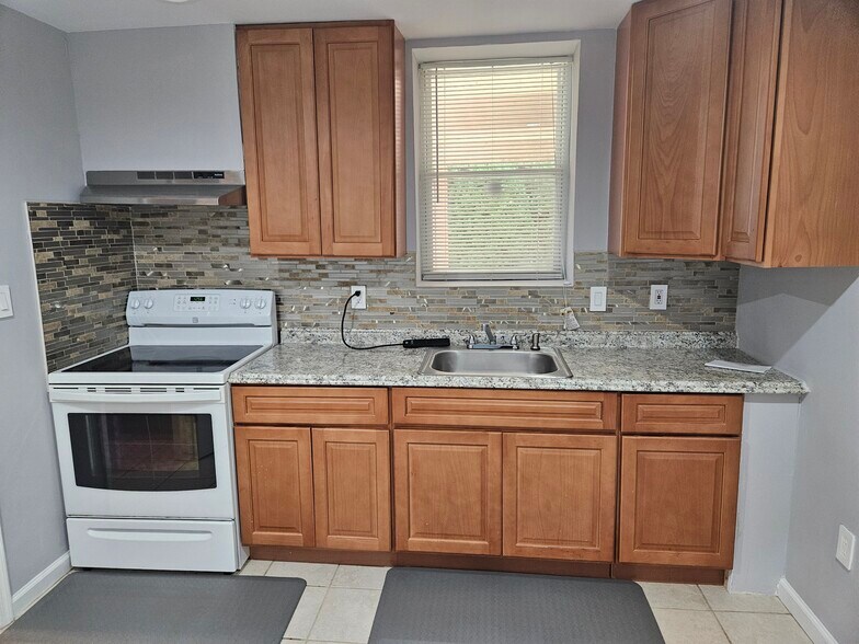 Full Kitchen with Sink and Microwave - 7508 Tarpley Dr