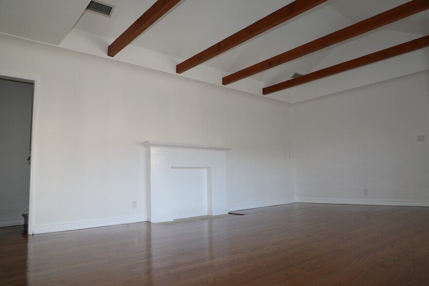 LARGE LIVING ROOM w/ hardwood floors & fireplace - 1413 S Beverly Glen Blvd
