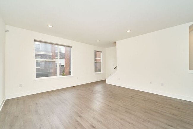 Building Photo - Like New Townhome With Your Own Rooftop Views of Downtown Indy!
