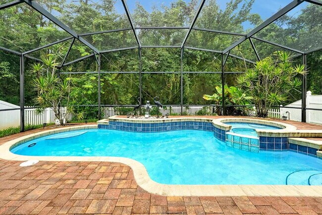 Building Photo - "Stunning 3BR Orlando Home with Private Screened Pool, Spa & Spacious Living Areas"