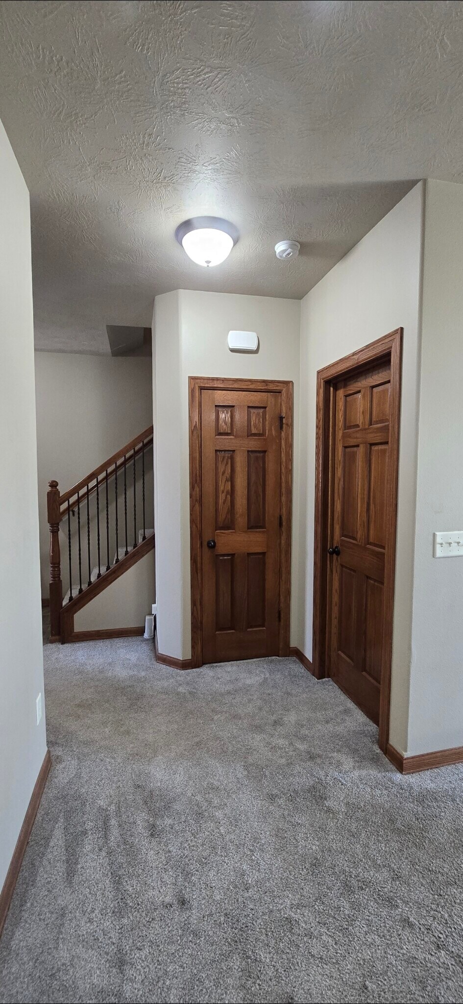 Coat closet (left) and half bath (right) off of main entry - 8413 W 53rd St