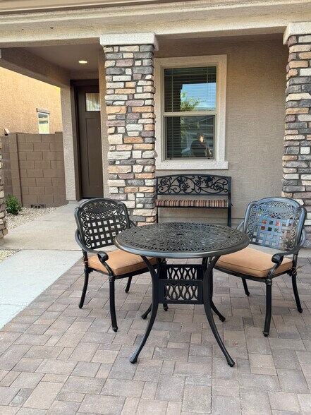 Front Porch with table and chairs in front courtyard - 8957 W Palo Verde Dr