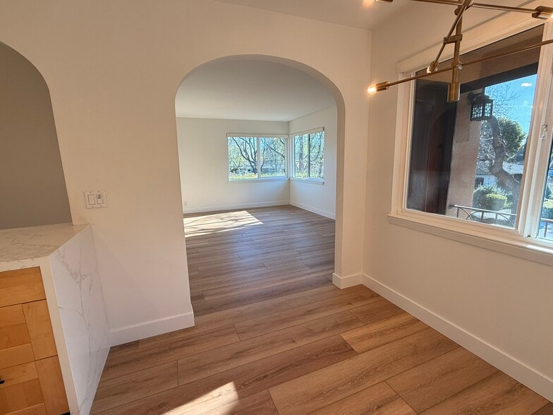 Dining area and living room in upstairs corner unit - 496 Sherwood Way