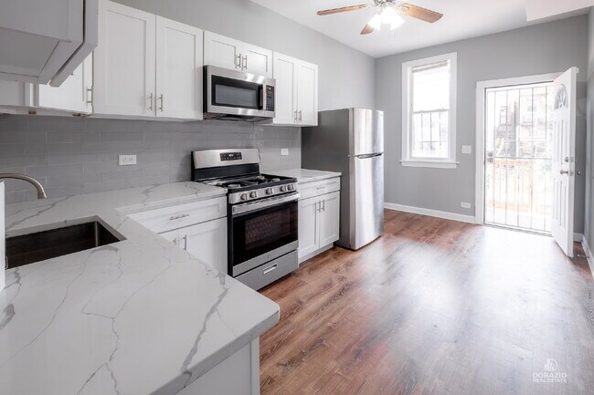 Building Photo - Modern 4BR Apartment with Hardwood Floors, Balcony & Central A/C