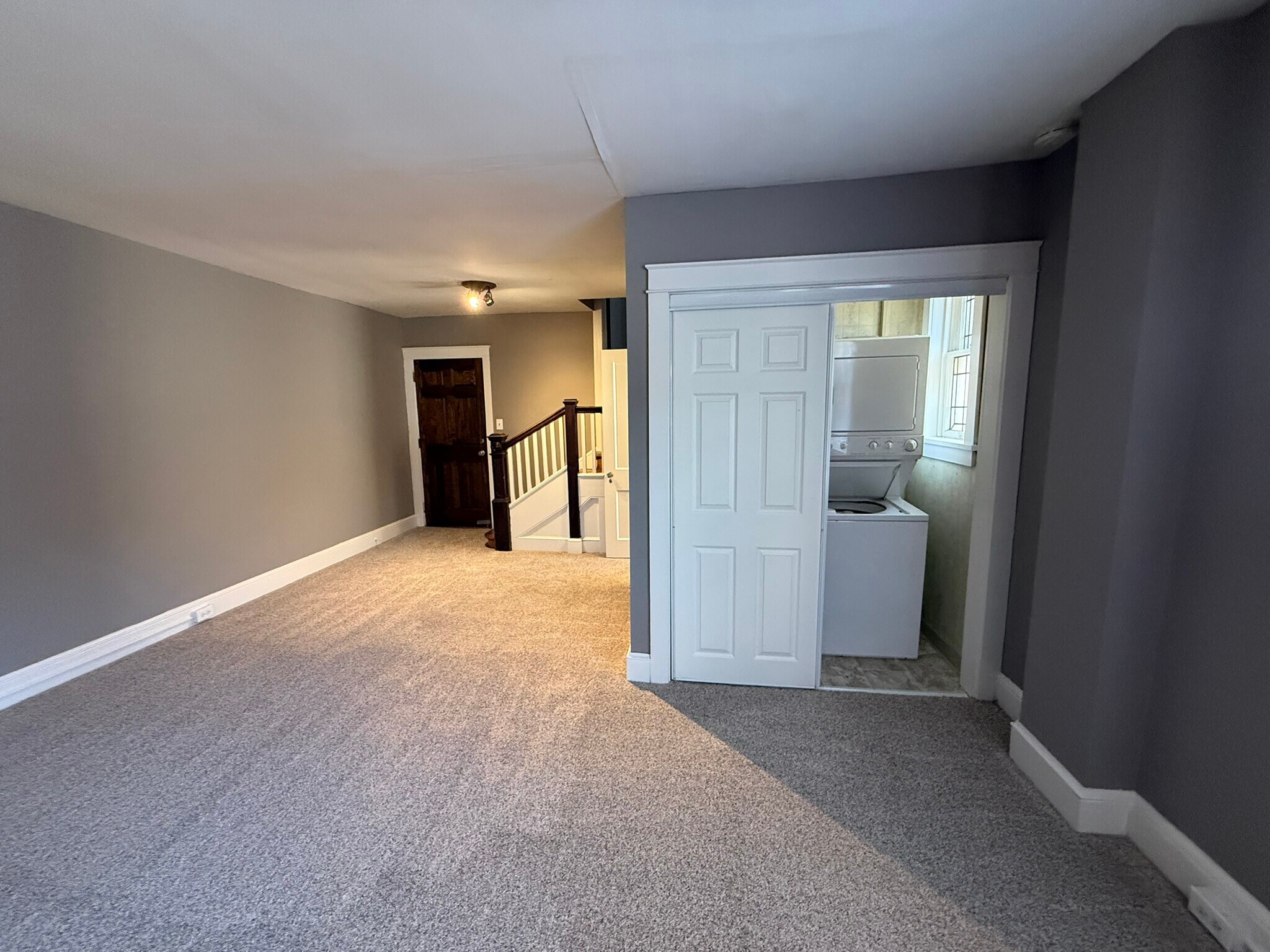 Living room entry area and laundry room - 218 E Orange St