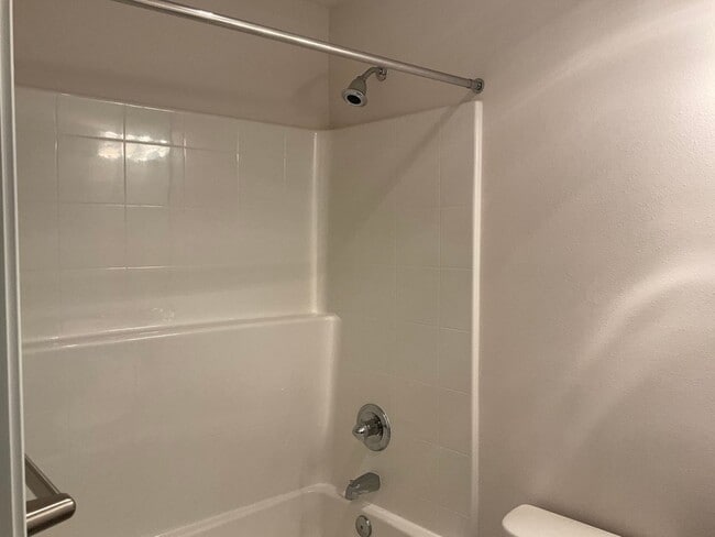 Building Photo - Riverfront Townhome with Tandem Garage & Fenced Yard