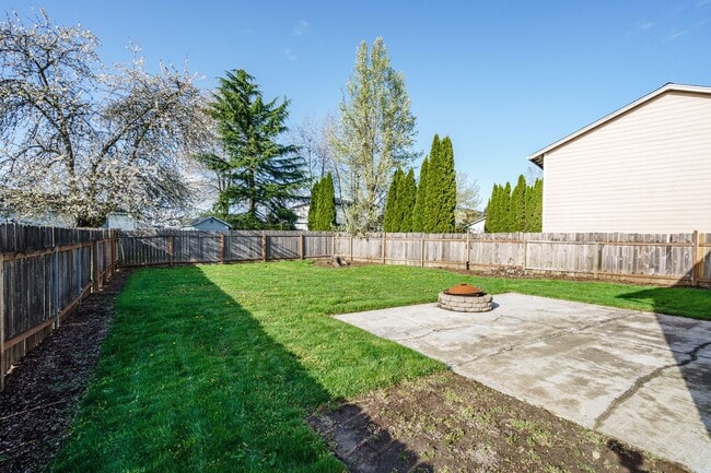 Building Photo - Recently Updated with Wood Laminate Flooring and Fresh Paint