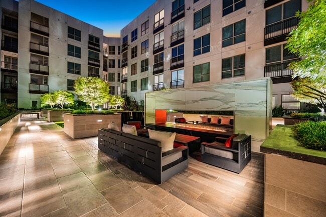 Expansive social courtyard with double-sided fireplace - The Overlook at Walnut Creek