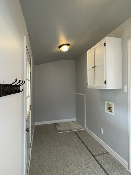 Mud room with crawl space storage - 303 E 4th St