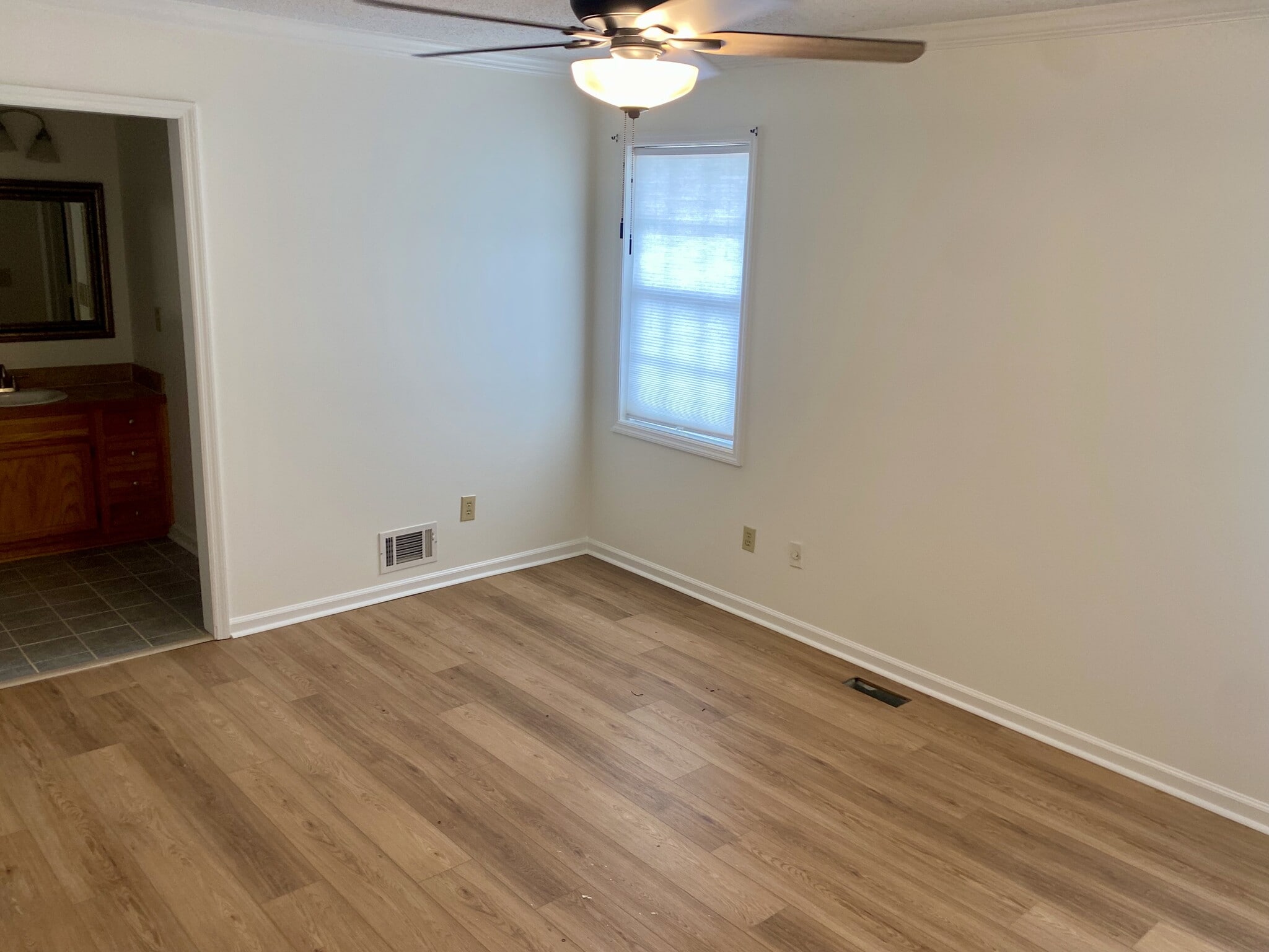 Windows overlooking the back yard and deck from above. - 7005 Sand Wedge Cir