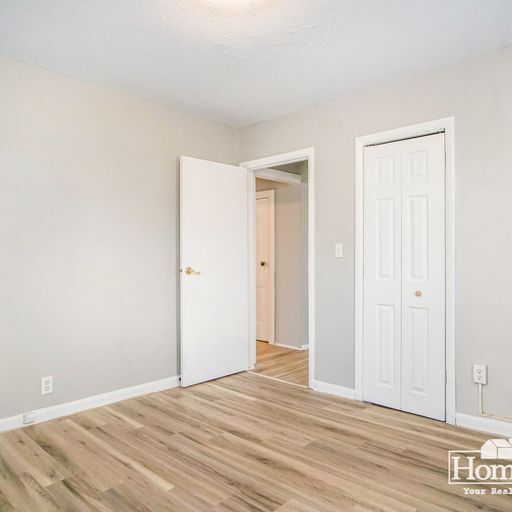 Building Photo - Charming two-bedroom, one-bath home offering a comfortable layout with ample natural light