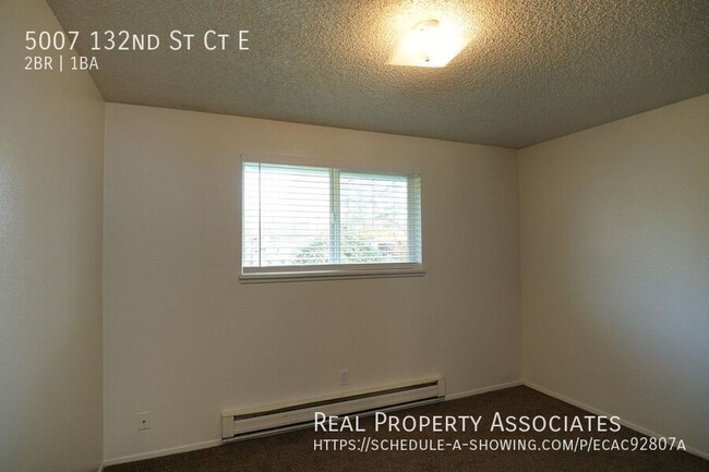 Building Photo - Spacious Two Bedroom Duplex Home with an A...