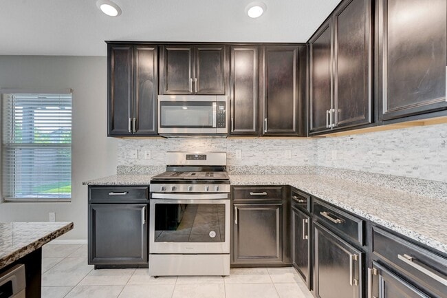 Building Photo - EXCEPTIONAL 4 BEDROOM, 3 BATHROOM HOME!