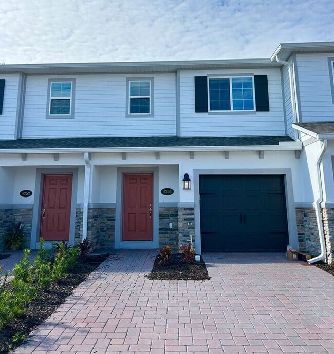 Building Photo - Brand-New 3/3 Modern Townhome in Gated Tys...