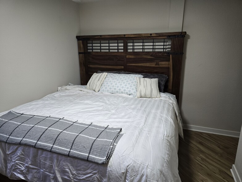 King bed downstairs. - 902 S Zephyr Ct