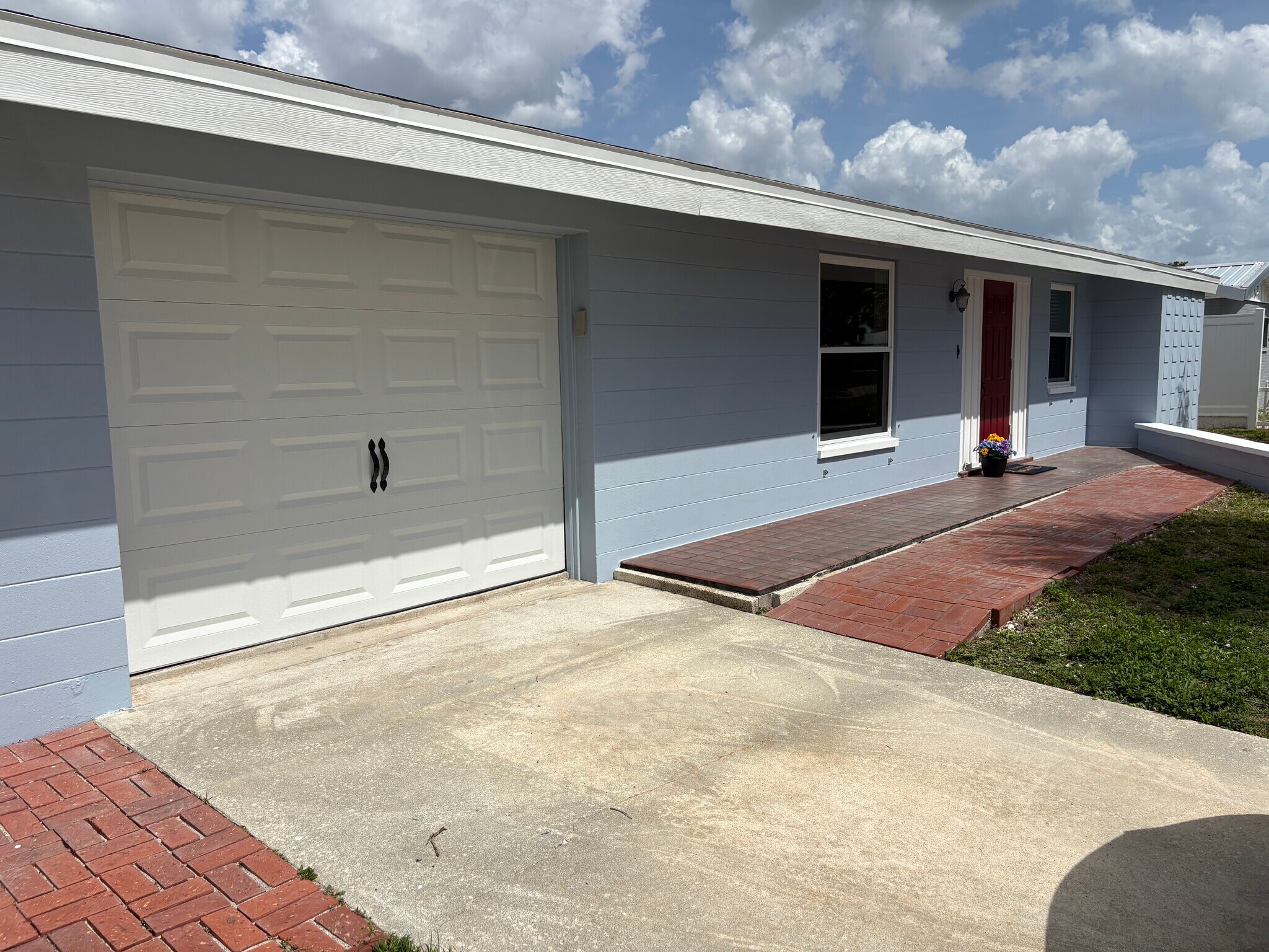 House has been freshly painted with new garage door. Coming soon White starfish shutters! - 4332 S Atlantic Cir