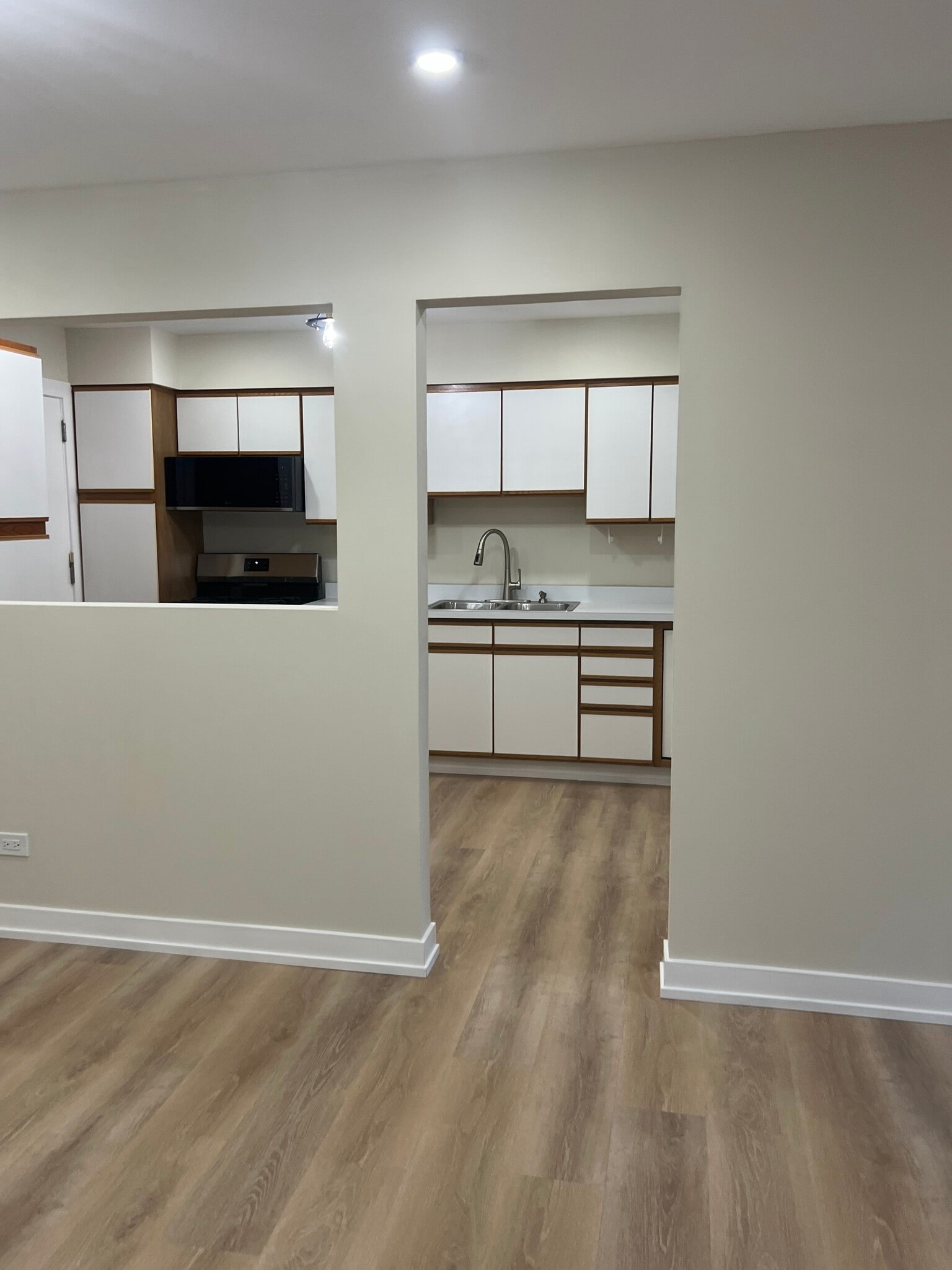 View of the kitchen from dining area - 10381 Dearlove Rd
