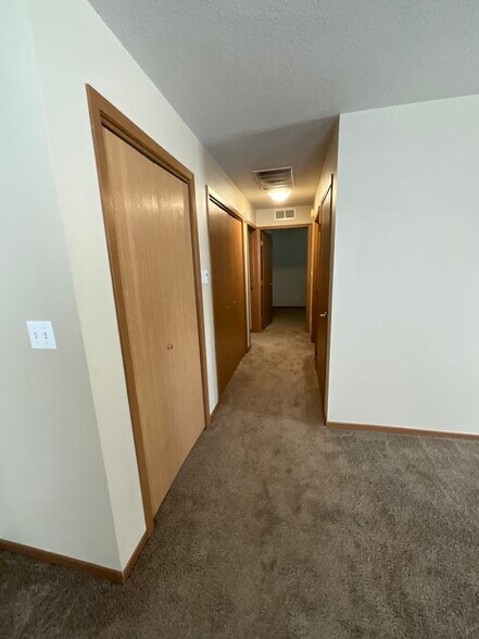 Hallway with 3 storage closests - 4609 S Baha Ave
