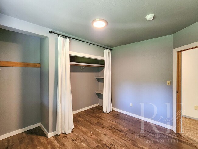 Building Photo - Vaulted Ceilings, Unique Designer Kitchen & Expansive Half-Acre Setting with Flexible Living Spaces