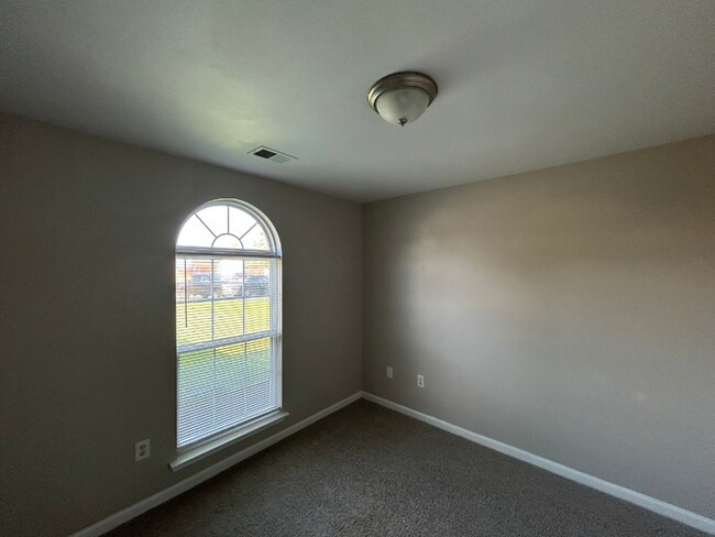 Building Photo - Spacious 4BR/2BA Olive Branch Home | 1,965 Sq Ft, Modern Fireplace, Bay Window & 2-Car Garage