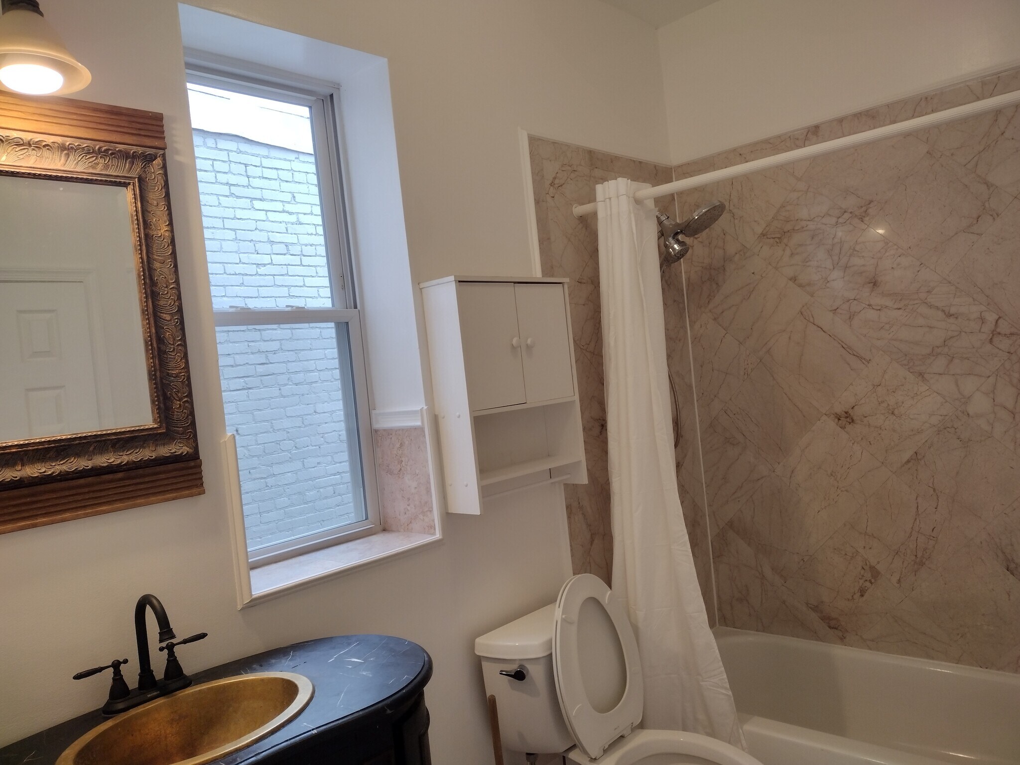 Second Full Bathroom (Jack-and-Jill Style) Spacious bathroom connected to both the second and third - 1933 4th St NW