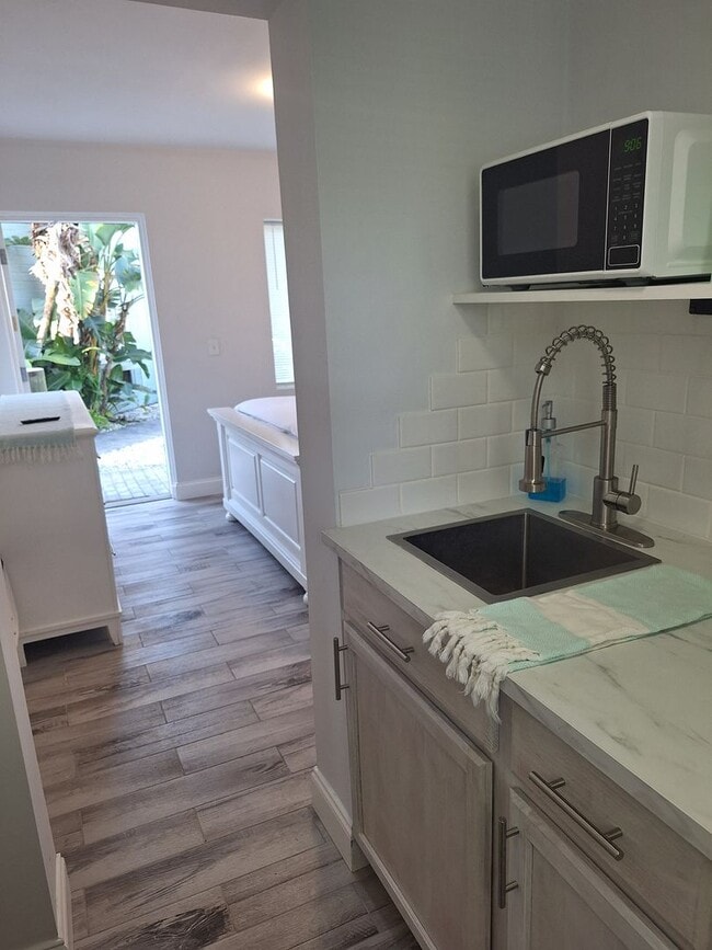 Building Photo - LONG TERM FURNISHED EFFICIENCY-ALL UTILITES INCLUDED!