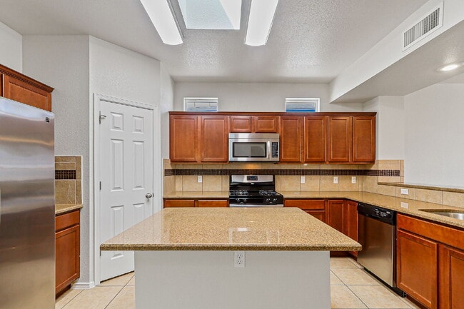 Building Photo - "Spacious 4-Bed Oasis with Granite Touches...