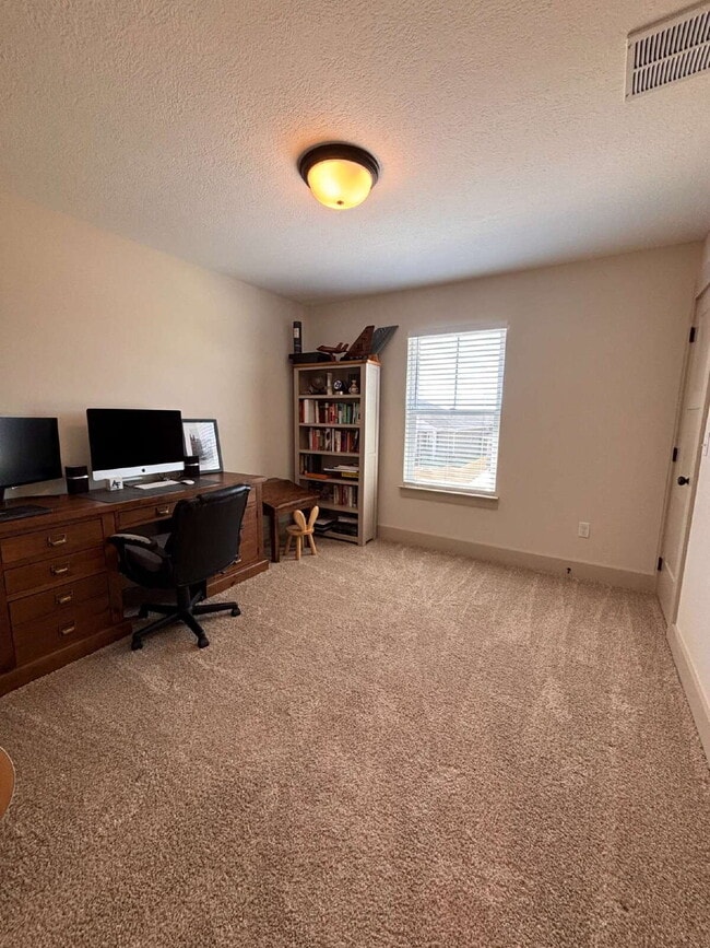 Building Photo - Need Space?  How about 5 bedrooms, 2.5 baths + an extra bonus area upstairs so that the kids can ...