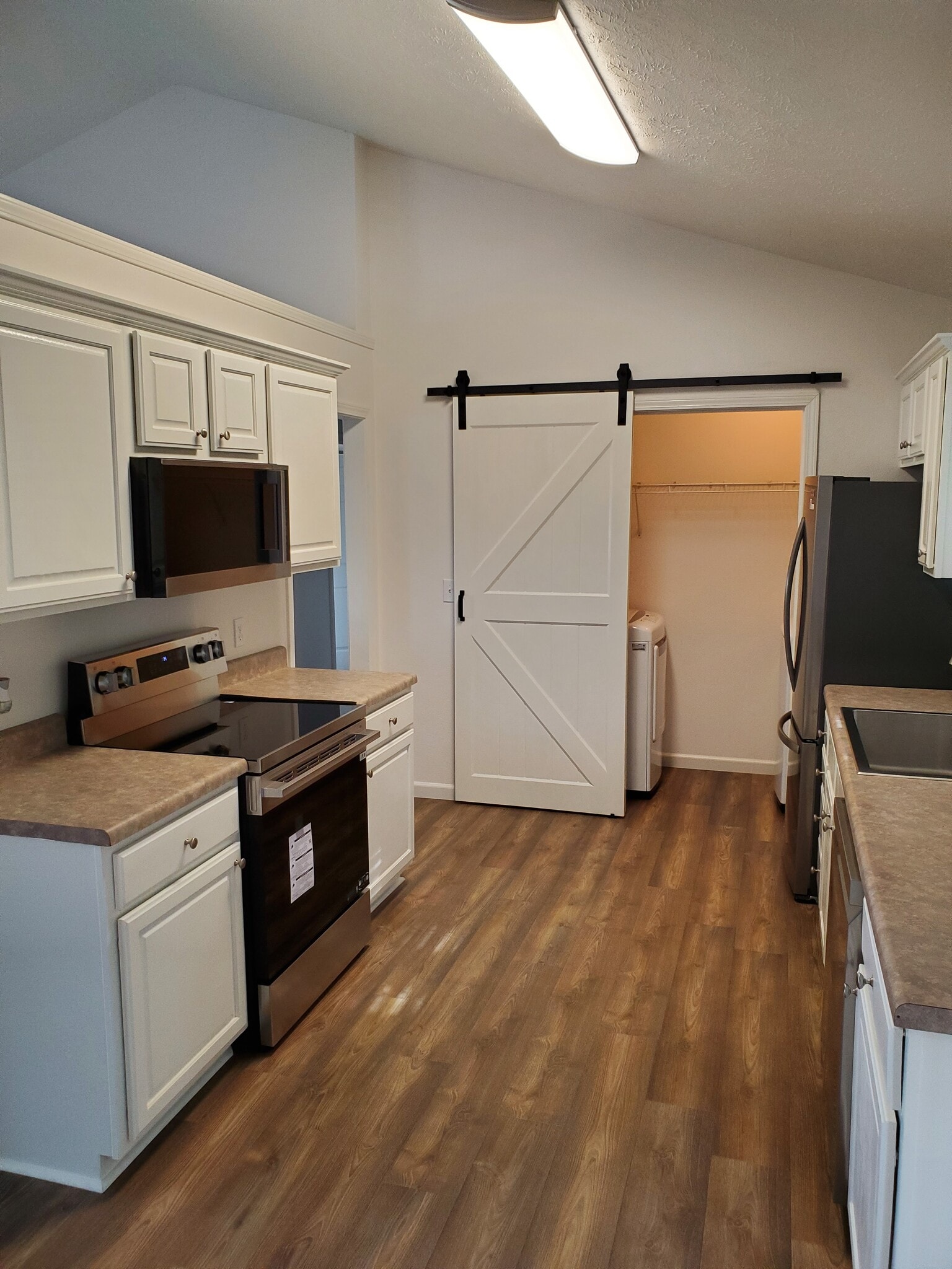 Left Side of Kitchen with Barn Door - 190 Forest Ln