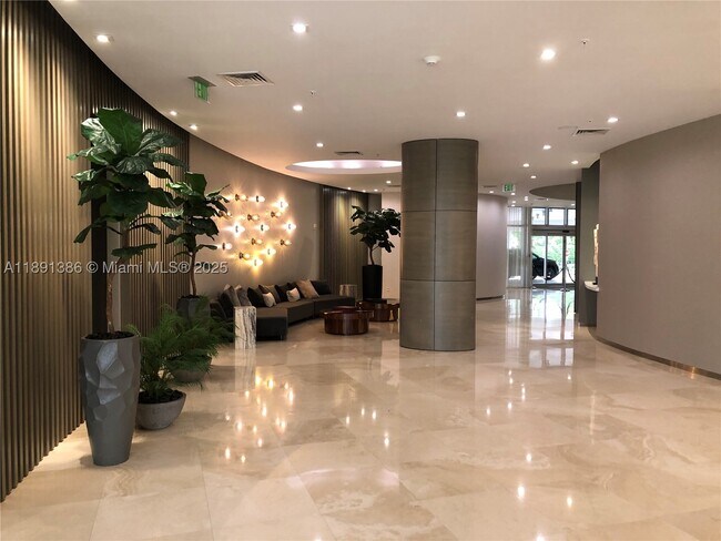 Building Photo - 10275 Collins Ave