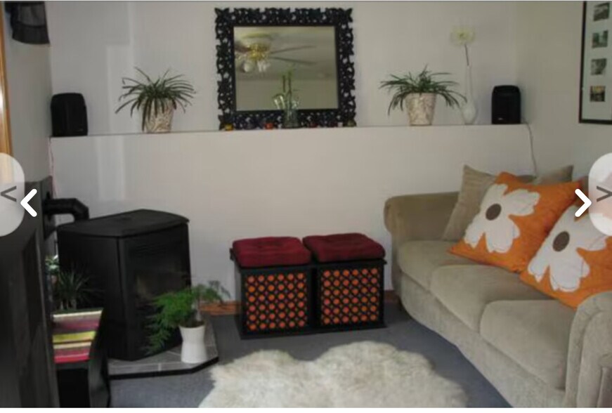 Partial view of living room-note the built in shelve. - 26 Rochester St