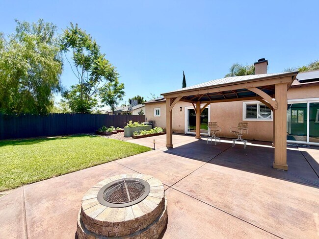 Building Photo - Beautifully Renovated 4 Bedroom Home with INCLUDED Solar, Large Backyard & Gazebo