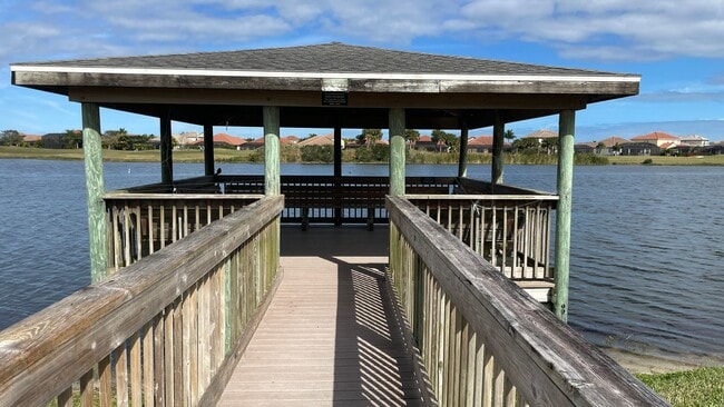 Building Photo - Elevated Luxury at The Terraces – 4th Floor Lake & Golf Course Views! 55+ Community!