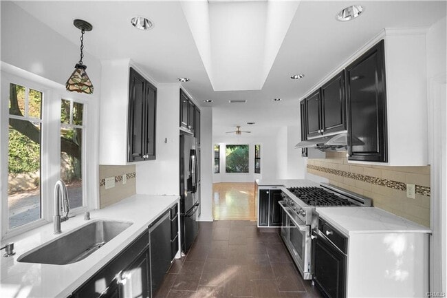 Building Photo - Tucked away behind gorgeous grand gates is this beautifully updated 3 bedroom 2 bath home