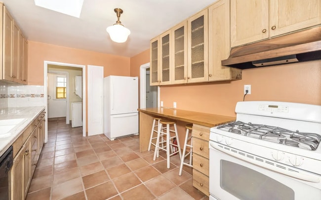 Building Photo - Charming Spanish Style Cottage with Incredible Deck- Gardener's Delight!