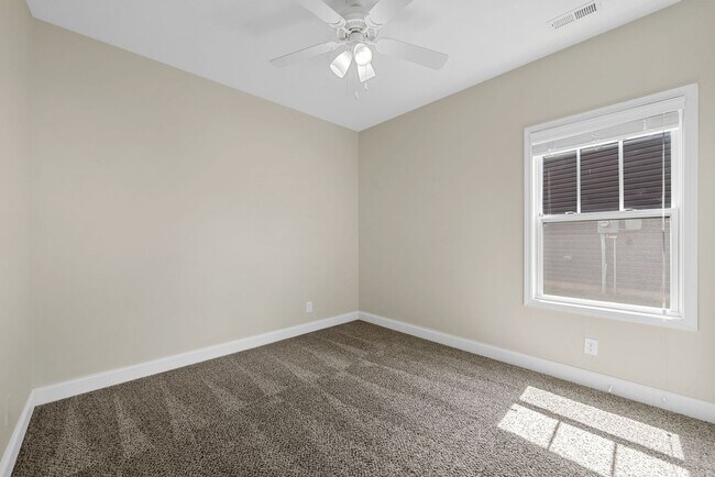 Building Photo - Pet Friendly Three Bedroom with Bonus!