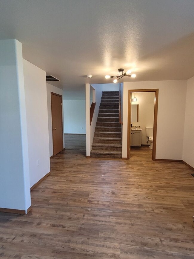 Building Photo - August Rent FREE - 4 Bedroom / Triple Car Garage