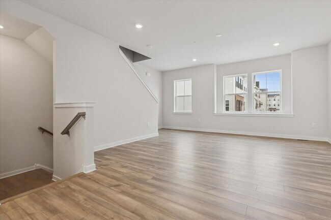 Building Photo - COMING SOON! Brand New River Pointe townhome with modern finishes, flexible living space, and a p...