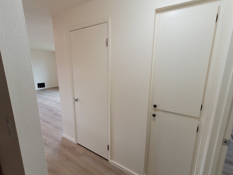 Hallway with linen closet and pantry - 1045 S Jasper St